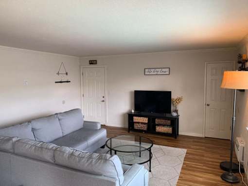a living room with a couch and a tv