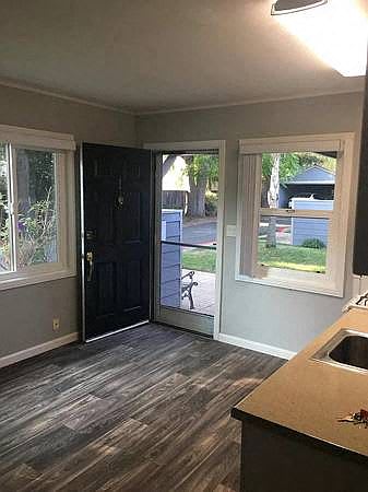 A kitchen with a sink and a window.