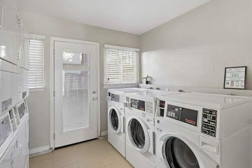 A laundry room with a washer and dryer.