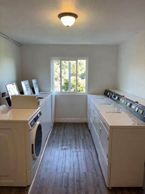 A laundry room with a washer and dryer in it.