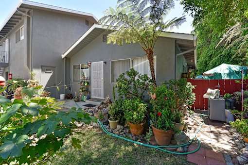 A house with a garden in front.