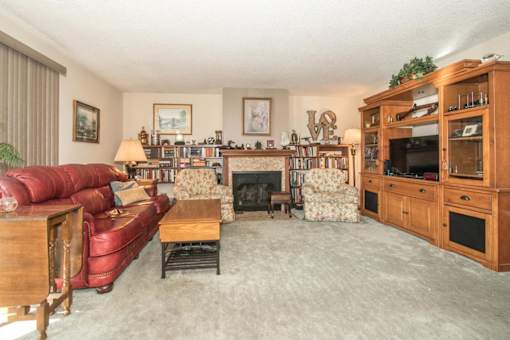 a living room with multicolored tiles on the floor