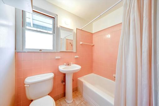 a bathroom with a sink toilet and a bath tub