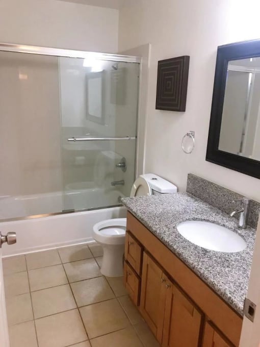 a bathroom with a sink toilet and a shower
