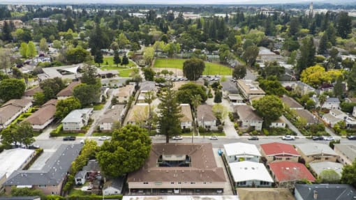 an aerial view of a neighborhood with houses and trees