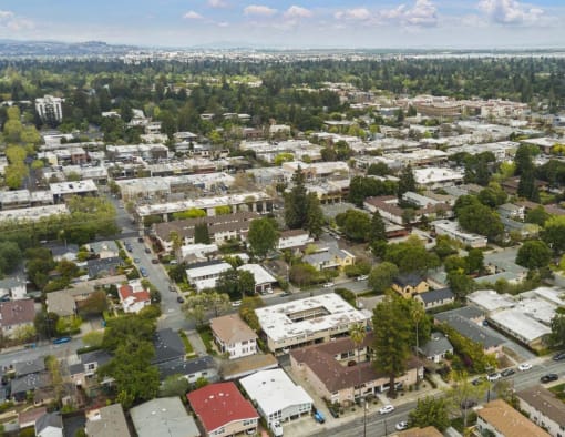 an aerial view of a city with houses and trees