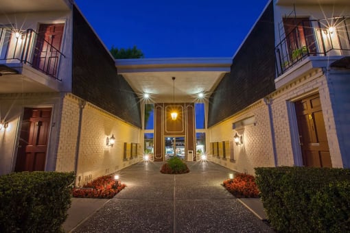 a night time view of the front entrance of the ascend hotel collection