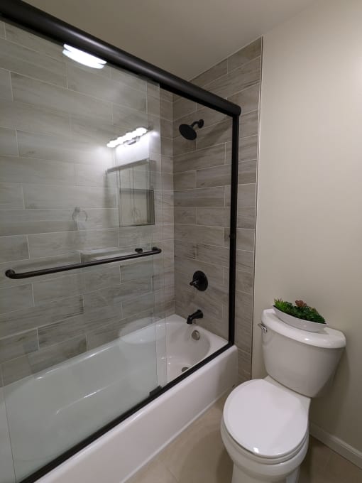 a small bathroom with a toilet and a shower