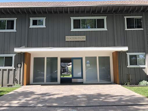 the front door of the renovated plans building