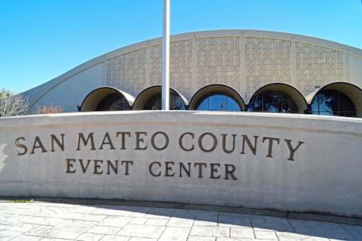 the exterior of the county event center in front of a building
