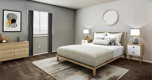 A bedroom with a bed, nightstands, and a rug.