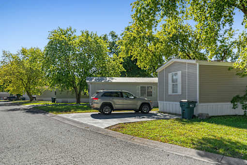 A car is parked in front of a house.