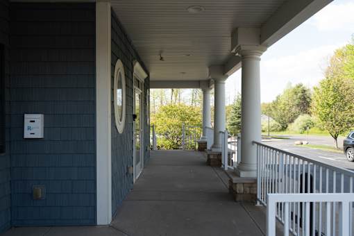 A long covered walkway with columns on the side.