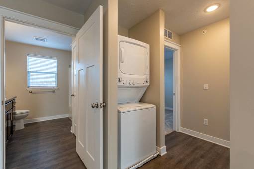 A small laundry room with a washer and dryer.