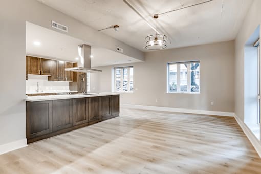 A spacious kitchen with wooden floors and a large island