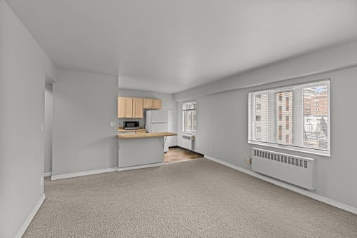 A room with a desk and a window
