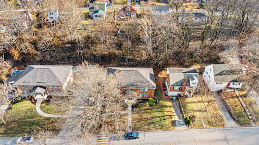 A residential area with houses and trees.