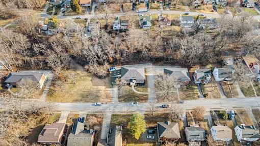 A suburban neighborhood with houses and trees.