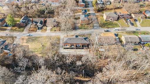 A residential area with houses and trees.