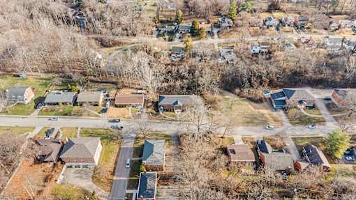 A residential area with houses and trees.