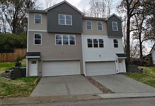 A two-story house with a garage.