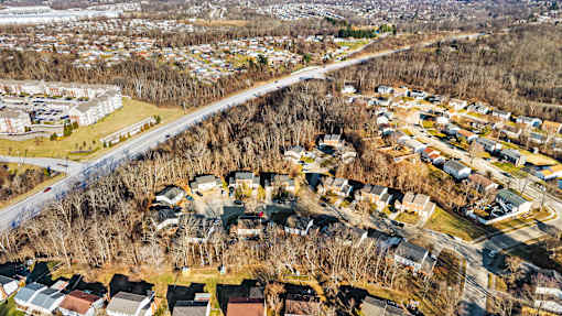 A residential area with houses and trees.