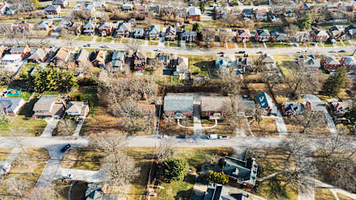 A residential area with houses and trees.