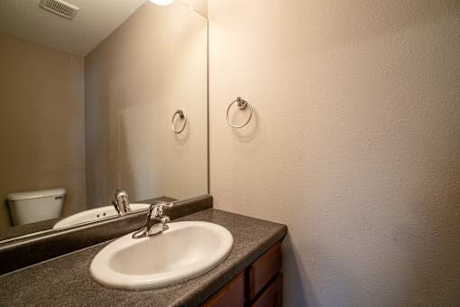 A bathroom sink with a mirror above it.
