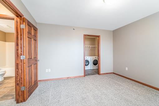 A laundry room with a washer and dryer in it.