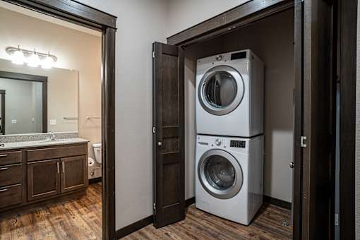 A white washer and dryer in a small laundry room.