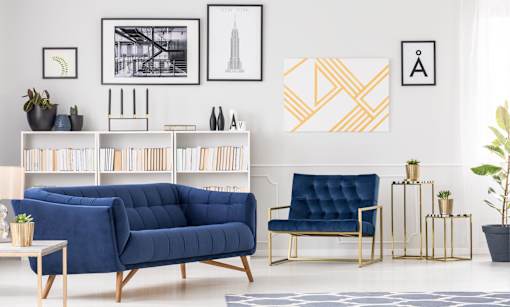 A living room with a blue sofa and a coffee table.