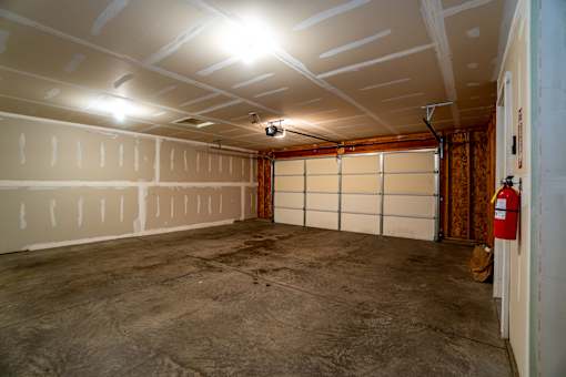A room with a fire extinguisher on the right side.
