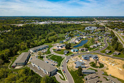 A bird's eye view of a residential area with a mix of houses and buildings.