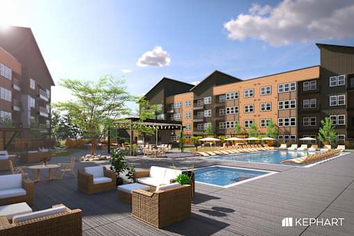 A Kephart residential complex with a pool and outdoor seating area.