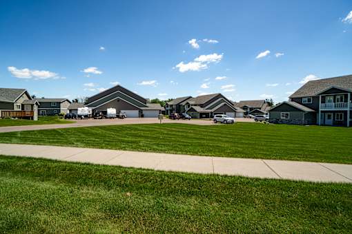 A row of houses with a clear blue sky above them.