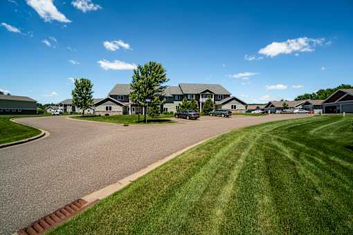 A residential area with houses and a clear sky.