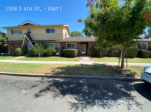 A house with the text 1508 S 4TH ST., - UNIT I on it.