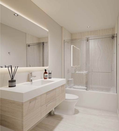 A modern bathroom with a white sink and a toilet.