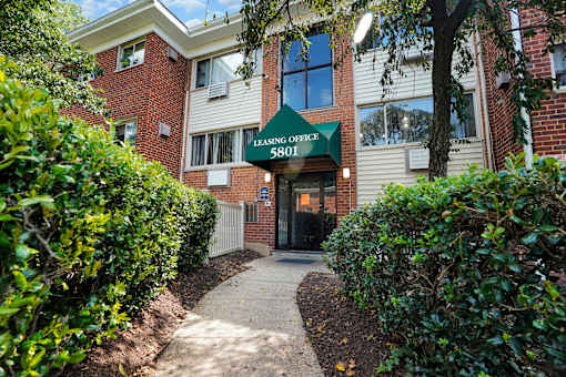 The image shows a building with a sign that reads "Leasing Office 5801".