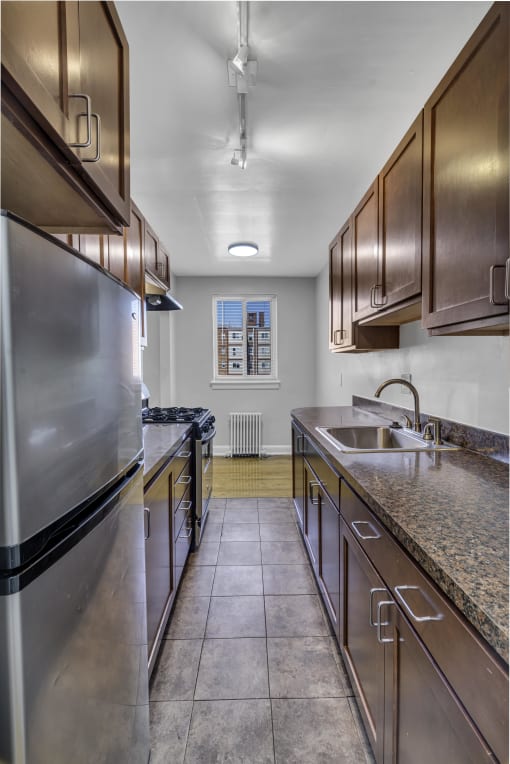 a kitchen with stainless steel appliances and granite counter tops