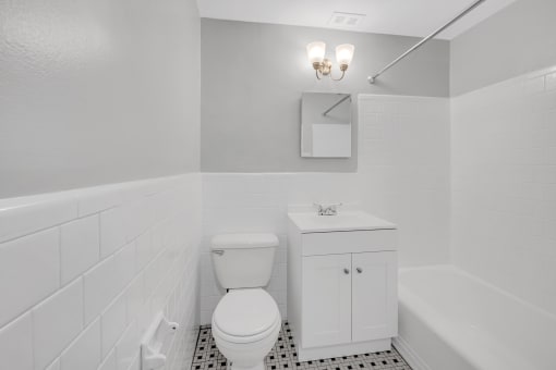 an empty bathroom with a toilet and a sink