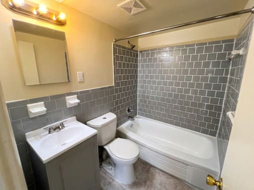 A bathroom with a white toilet and sink.