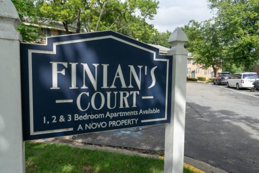 a sign for finlands court in front of a street