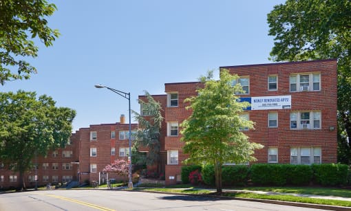 a large red brick building on the corner of a street