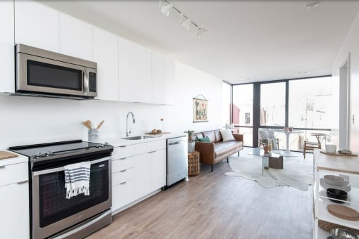 a kitchen and living room in a 555 waverly unit