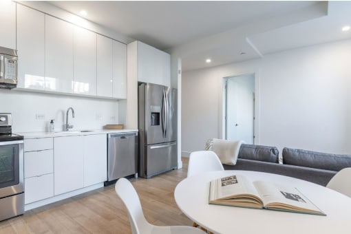 a kitchen and living room in a 555 waverly unit