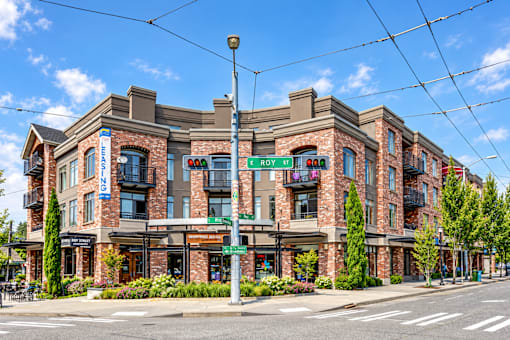 A street view of a building with a sign that says "ROY ST".