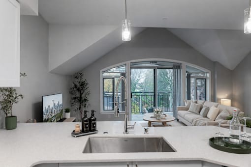 A modern kitchen with a large island and a sink.