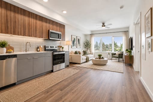 A modern kitchen with wooden cabinets and stainless steel appliances.