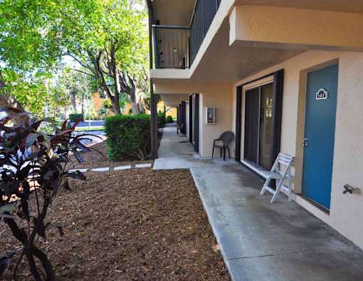 A blue door is on the right side of a building.